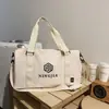 Bolsa de viagem de moda transfronteiriça nova de grande capacidade, moderna, casual, portátil, bolsa de ginástica, bolsa de ombro para armazenamento de bagagem, comércio exterior