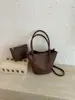 Bolso Cubo Tejido Estilo Coreano INS Súper Popular Transfronterizo para Mujer 2026 Nuevo de Gama Alta Versátil para el Trabajo Bolso de Hombro Único Cruzado