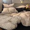 Conjunto de cama de quatro peças em gaze de camada dupla estilo nórdico, adequado para dormitórios estudantis, camas de solteiro ou casal, incluindo uma capa de edredom e um lençol de cama, e pode ser usado em todas as quatro estações