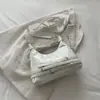 Bolso de mano vintage de cuero suave rojo de alta calidad para mujer 2026 nuevo estilo estilo chica popular bolso de axila de motocicleta bolso de un solo hombro