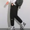 Calças masculinas de veludo cotelê para outono, calças esportivas, calças de moletom masculinas, largas e versáteis, calças casuais com patchwork, calças jogger, calças compridas