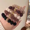 Outono e inverno cabelo de pelúcia corda faixa de cabelo corda de cabelo de strass de alta qualidade das mulheres 2023 nova cabeça de bola gravata cabelo elástico cocar