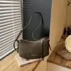 Bolso liso muy elegante 2026 nuevo bolso de axila francés de nicho para el día a día bolso de hombro cruzado casual a la moda para mujer