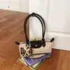 Bolsa baguette de camurça vintage de alta qualidade para mulheres, nova bolsa de ombro/axila de moda de nicho 2026, bolsa de mão para o dia a dia