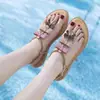 Sandalias planas romanas de dedo para mujer 2026 con lazo de pedrería y hebilla de una sola tira, zapatos de verano para mujer para combinar con faldas, tacón plano