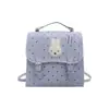 A bolsa feminina quadrada pequena e fresca popular deste ano 2026 outono nova bolsa de ombro única de bolinhas de luxo leve mochila versátil