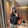 Camiseta de manga larga de algodón puro para mujer, a la moda y tendencia, con estampado de perro estilo coreano, capa base reductora de edad, nuevo modelo de otoño 2026