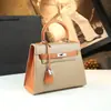Bolso de mujer de piel genuina de alta gama 2026 nuevo color de moda bolso Kelly bicolor, elegante bolso de mano y bolso cruzado para el día a día segunda generación