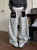 Jeans de bolsillo tipo parche con estampado de leopardo retro americano transfronterizos, unisex, corte holgado, estilo callejero, pierna ancha, pierna curva, pantalones largos casuales