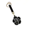 Bestseller transfronterizo creativo colgante llavero rosa incrustado de diamantes accesorio de bolso flor de strass de cuero regalo decoración