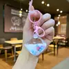 Llavero Creativo de Arena Líquida Flor de Cerezo Frijol de Leche Acrílico Infundido con Aceite Adorno Rosa Colgante para Bolso de Coche Cadena de Coche Venta al por Mayor