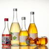 Fábrica al por mayor de alto valor de color botella de vino de frutas de vidrio botella de vino botella de bebida espesa botella de leche botella de múltiples capacidades sellado fuerte