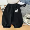 Pantalones casuales para niños, estilo primavera y otoño, corte holgado, pantalones modernos estilo coreano para niños, pantalones largos para niños mayores, marrones y negros, disponibles para venta al por mayor