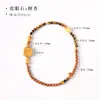 Pulsera de sándalo verde estilo zen de doble hilo, disponible en varios diseños, con un tallado en madera maciza con el carácter "Ji" y un colgante cuadrado, combinada con una pulsera de cuentas de ojo de tigre dorado.