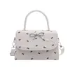 Bolso de mano estilo coreano con lazo para mujer, nuevo modelo 2026, bolso bandolera de un solo hombro, bolso de mano de lunares de alta gama, bolso cuadrado pequeño
