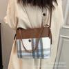 Bolsas de moda de este año: Bolsos tipo cubo para mujer, Nuevos bolsos de hombro a cuadros de moda 2026, Bolsos cruzados de lana para otoño e invierno