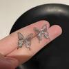 Pendientes de clip para mujer, diseño de nicho, de alta calidad, con mariposa azul, estrella de cinco puntas y perla, estilo popular de 2024