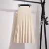 Novo saia midi de tricô de cintura alta para outono e inverno para mulheres, saia plissada de lã em linha A com barra larga em estilo universitário, para ser combinada com um suéter