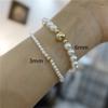 A NOSOTROS. Bolsa de oro de 14K no se desvanece con snitch estilo clásico simple Shi Jia Perla temperamento Pulsera Joker 6mm