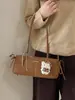 Bolsa de Axila Fashion Retrô para Mulheres 2026 Nova Tendência de Inverno Exquisite Versátil Bolsa Baguete Bolsa de Mão Bolsa de Ombro Atacado