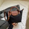 Bolsa de Ombro Único Transversal de Alta Gama Transfronteiriça para Nicho Moda Outono e Inverno 2025 Grande Capacidade Bolsa Dumpling Bolsa Tote