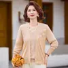 Conjunto de top de manga larga de alta gama para otoño para madres, nuevo estilo primavera y otoño 2026, conjunto de chal de punto para mujeres de mediana edad y mayores