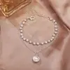 Collar con colgante de perlas de doble capa minimalista para mujer, versátil y elegante, con un aire de moda de alta gama, cadena para la clavícula de diseño único