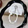 Correa de cadena para teléfono con cuentas de cristal, colgante de estrella colorida del cielo estrellado, cadena para colgar el teléfono, accesorio popular para bolso, pequeño regalo