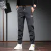 Pantalones de trabajo resistentes al desgaste para trabajadores de reparación de automóviles en sitios de construcción para trabajos ocasionales Pantalones de protección laboral sueltos resistentes al desgaste para hombres en otoño