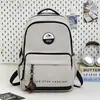 Mochila de alto valor grande capacidade bolsa de ombro dupla bolsa de ombro dupla casual da moda mochila para novos estudantes mochila de estudante com letras