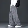 Pantalones de pana a cuadros para hombre Otoño 2025 Nuevos Holgados Rectos Casuales de Moda Pantalones de Pierna Ancha Estilo Americano