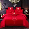 Juego de ropa de cama de lujo estilo chino, hecho de algodón 100% de fibra larga, un juego de cuatro piezas que incluye una sábana y una funda de edredón de algodón puro rojo, perfecto para la alcoba de una recién casada.