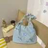 Bolsa de ombro doce e fofa em formato de laço amarelo leitoso, com design de alça de ombro franzida, uma bolsa transversal fofa para meninas