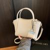 Bolso de Cubo Portátil Sencillo y de Alta Gama Transfronterizo para Mujer 2025 Nuevo Bolso Cruzado de Moda Nicho Bolso de Hombro para Viajes