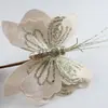 Adornos de mariposas navideñas para comercio exterior transfronterizo, decoraciones para árboles de Navidad, arreglos florales de tela, adornos decorativos, mariposas artificiales al por mayor