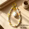 Colgante de pato de moda con lazo, cuentas de queso, llavero, correa para teléfono, accesorio para bolso, accesorio de bricolaje, regalo