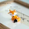 Bestseller transfronteiriço Jingdezhen cerâmica raposa rotativa desenho animado ornamento criativo vidro artesanato ornamento atacado