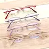 Montura de gafas de medio aro ovalada simple retro de titanio puro al por mayor para cara pequeña miopía montura de gafas de placa de montura pequeña para mujer