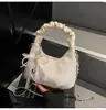Bolso Tote Pequeño de Cadena Plegada Color Sólido con Lazo de Perlas 2026 Nuevo Casual Diseño Simple para Oficina para Mujer