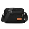 Bolso de negocios multicapa de lona resistente al desgaste para mujer, bolso de venta al por mayor, bolso cruzado, bolso informal, bolso cuadrado pequeño para hombre.