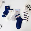 Calcetines infantiles Yishuangshuang, nuevos calcetines de media caña de marca de moda para otoño e invierno, calcetines a rayas de algodón peinado para estudiantes, sin costuras