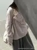 Camiseta rosa de manga larga con diseño de borde enrollado para mujer, nuevo estilo otoño 2026, corte holgado, top adelgazante
