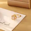 Anillo Abierto Giratorio de Circonita con Trébol de Cuatro Hojas Micro-Pavimentado Moda Lujo Accesible Nicho Moda Exquisita Anillo Ajustable para Mujeres