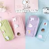 Versión coreana de estuche de papelería de dibujos animados de gran capacidad, lona simple para cuentas a mano, bolsa para bolígrafos, bolsa de almacenamiento para estudiantes pequeña y fresca, venta al por mayor al contado