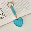 Llavero de Corazón de Diamante Completo de Venta Caliente Cross Colgante de Bolso de Corazón de Melocotón con Pedrería Llavero de Coche Personalidad de Moda Colgante