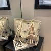 Bolsa estampada de nicho feminina, nova chegada 2025, bolsa de ombro portátil de grande capacidade, bolsa casual para estudantes, para todos os tipos de uso diário