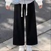 Conjunto moderno estilo coreano para meninas 2026: top moderno com design de duas peças e gola estilosa, combinado com calças casuais simples, um conjunto versátil de duas peças