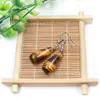 Venta al por mayor de fábrica aretes largos de cristal natural forma de gota de agua amatista Ojo de Tigre Joyería con gancho para la oreja aretes redondos de gota de agua DIY