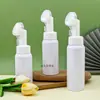 Botella dispensadora de espuma tipo mousse blanca 200 ~ 300 ml botella limpiadora facial botella de limpieza botella de espuma con cabezal de cepillo de silicona de plástico PET
