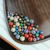 Venta al por mayor del fabricante Artesanía en Laca Color Esmalte Laca Esmalte Laca Ópalo Cinabrio Bolas Redondas Mineral Crudo Natural Hecho a Mano Puro